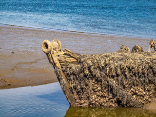 Abandoned boat wrack on a Muddy Riverbank, Lanester-Kerhervy, Brittany