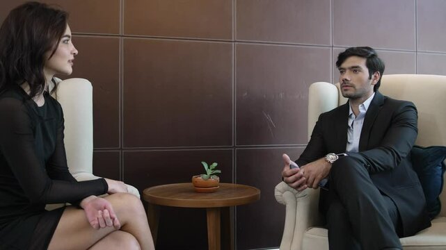 Businessman and woman meeting chat at the lobby for business plan, make a deal with partner or job interview