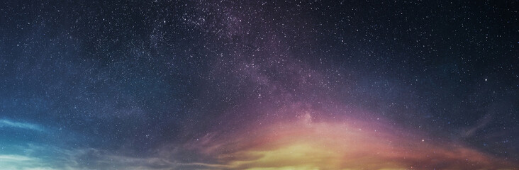 Amazing panoramic starry sky with stars and clouds. Lights of stars, space galaxy. Science background image. Starry wallpaper