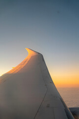 Looking from the window of plane at sunset