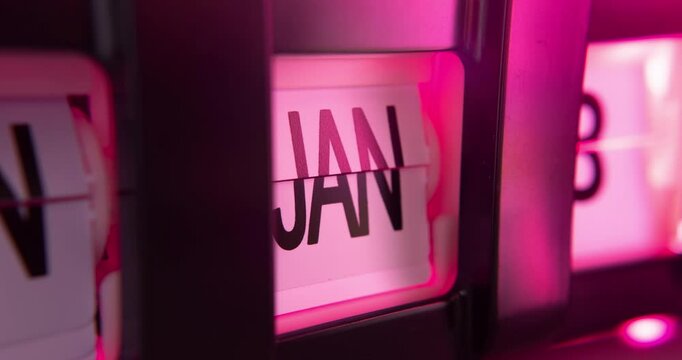 Timelapse of flip calendar clock in 1 year in pink light
