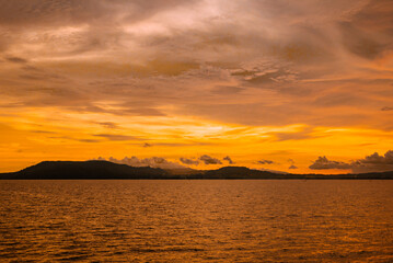 Sunset with dramatic clouds on tropical beach