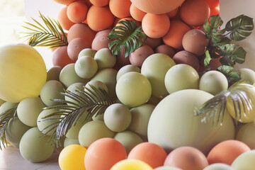 tropical party children party. background with balloons in green, red and yellow colours with tropical leaves. 