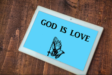 the words god is love on a tablet