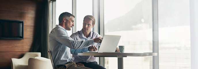 Business, men and discussion with laptop at office for advice, consultation and meeting on...