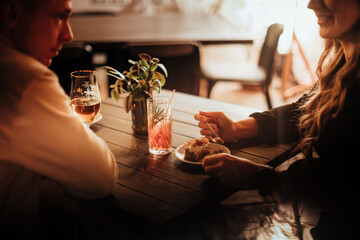 Couple Sharing Dessert and Drinks on a Date