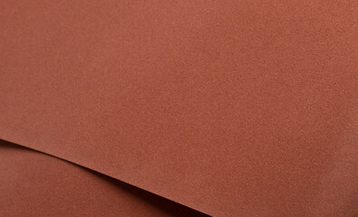Abstract designer paper background with a velvety, warm matte texture in rich earthy tones....