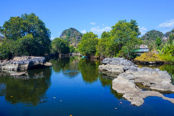 Fototapeta premium Maros Rammang-Rammang, panoramic views of clear rivers and shell rocks overlooking trees and mountains