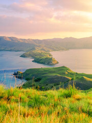 Beautiful and Colorful Sunrise form The Pacific Ocean at Gili Lawa, Komodo National Park, Indonesia. © Balnyes Visuals