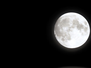 Obraz premium A full moon in the dark sky with a black background