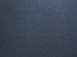 Luxurious designer paper background in deep navy blue with a smooth, satin like texture and subtle...