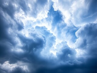 Fototapeta premium A blue sky with white clouds in the middle of it