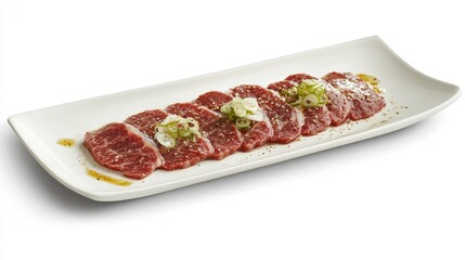 Obraz premium Fresh Sliced Beef with Garnish on a White Plate