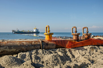 Westenschouwen, The Netherlands, October 26, 2024: pipeline on the beach during beach replenishment work