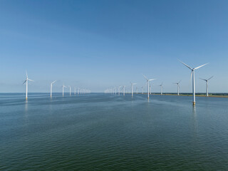 Windmills park in the sea near the coast of the flevopolder in the Netherlands