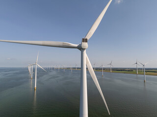 Windmills park in the sea near the coast of the flevopolder in the Netherlands