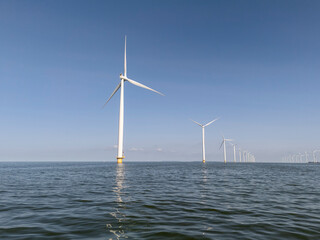 Windmills park in the sea near the coast of the flevopolder in the Netherlands