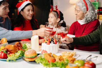 Celebrate Christmas with family in a cozy, festive setting. Santa hats, gifts, and delicious food capture the warmth, jo