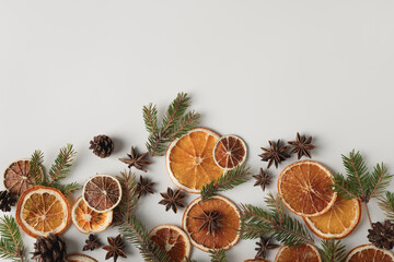 Natural organic composition with dried oranges, cones, star anise and fir twigs. Holidays concept, natural background.