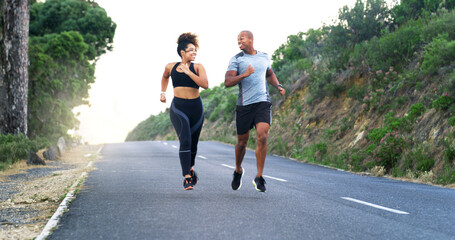 Fototapeta premium Happy couple, runner and outdoor on road in nature with training, speed or laugh for funny memory in summer. Woman, man and partnership with workout, exercise or challenge with teamwork in Costa Rica