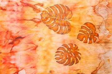 abstract pattern on silk fabric texture in yellow and brown tones