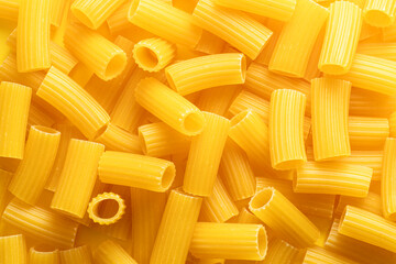 Italian dry pasta rigatoni close-up. Food background.