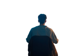 Video game addiction. Back view of man sitting in front of computer with trash and mess in the room, playing video games online