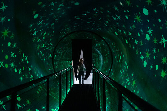 Fototapeta Optical illusion tunnel with a rotating cylinder. Attraction for vestibular apparatus training