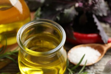 Cooking oil in jar on table, closeup