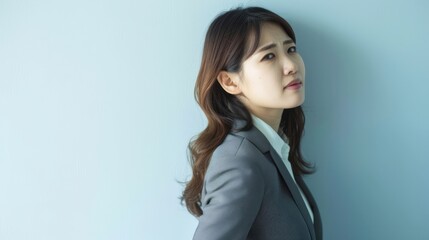 Fototapeta premium asian businesswoman side view boss manager serious stress worry look at the camera copy space white wall background