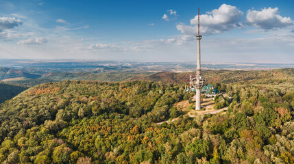 Obraz premium A broken structure from the 90s, the Fruska Gora broadcasting TV tower remains an architectural relic in the serene park in Serbia