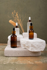 Amber and Frosted Glass Dropper Bottles on Natural Stone Display – Luxury Skincare Packaging Mockup