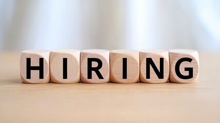 Hiring text bold type on wooden cube