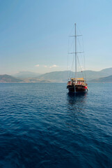 Traditional Gullet anchored. A traditional Turkish Gullet on a day trip anchored in a bay on the mediterranean.