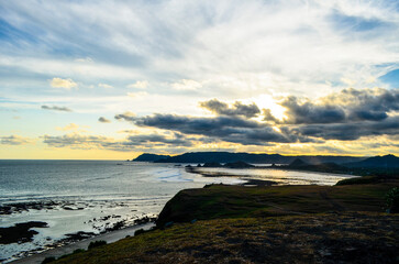 Naklejka premium Beautiful sunset with orange sky color and very beautiful on Senggigi Beach, Lombok