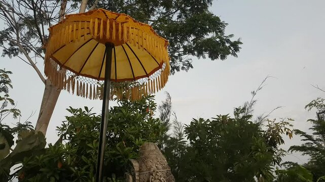 Balinese yellow umbrella used in traditional decorations.