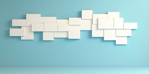 Fototapeta premium Modern wall design with white frames on a light blue background for aesthetic appeal.