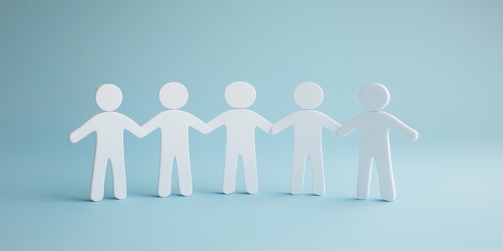 Paper cutouts of diverse people holding hands, symbolizing unity and connection.