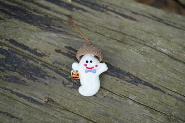 A toy ghost with an acorn hat.