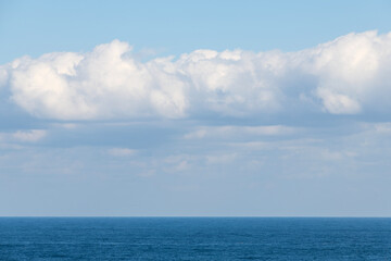 tranquil seascape with white clouds