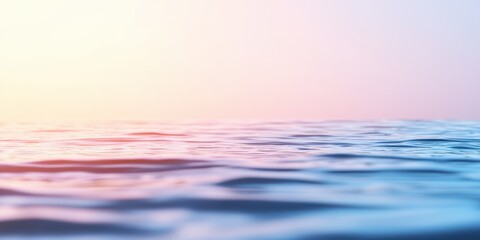 Obraz premium A serene view of calm water reflecting soft pastel hues, capturing tranquil nature vibes.