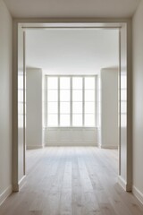 Fototapeta premium Spacious empty room with large window and hardwood floor.