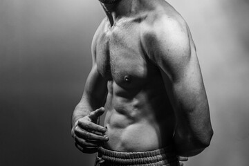 A young shirtless muscluar man