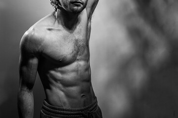 A young shirtless muscluar man