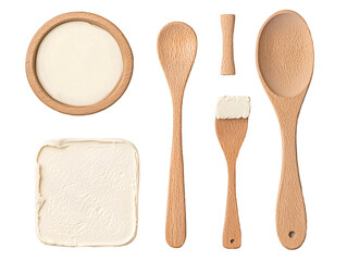 a wooden spoons and a bowl of cream