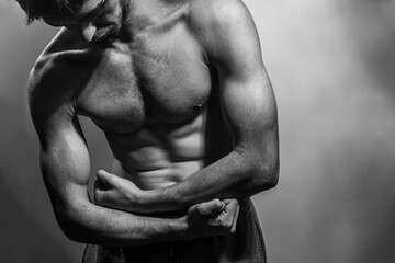 A young shirtless muscluar man
