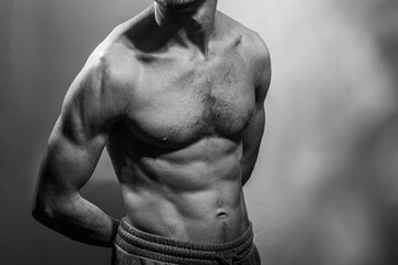 A young shirtless muscluar man