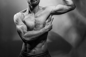 A young shirtless muscluar man