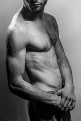 A young shirtless muscluar man