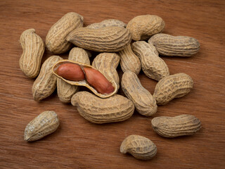 Peanuts on wooden background